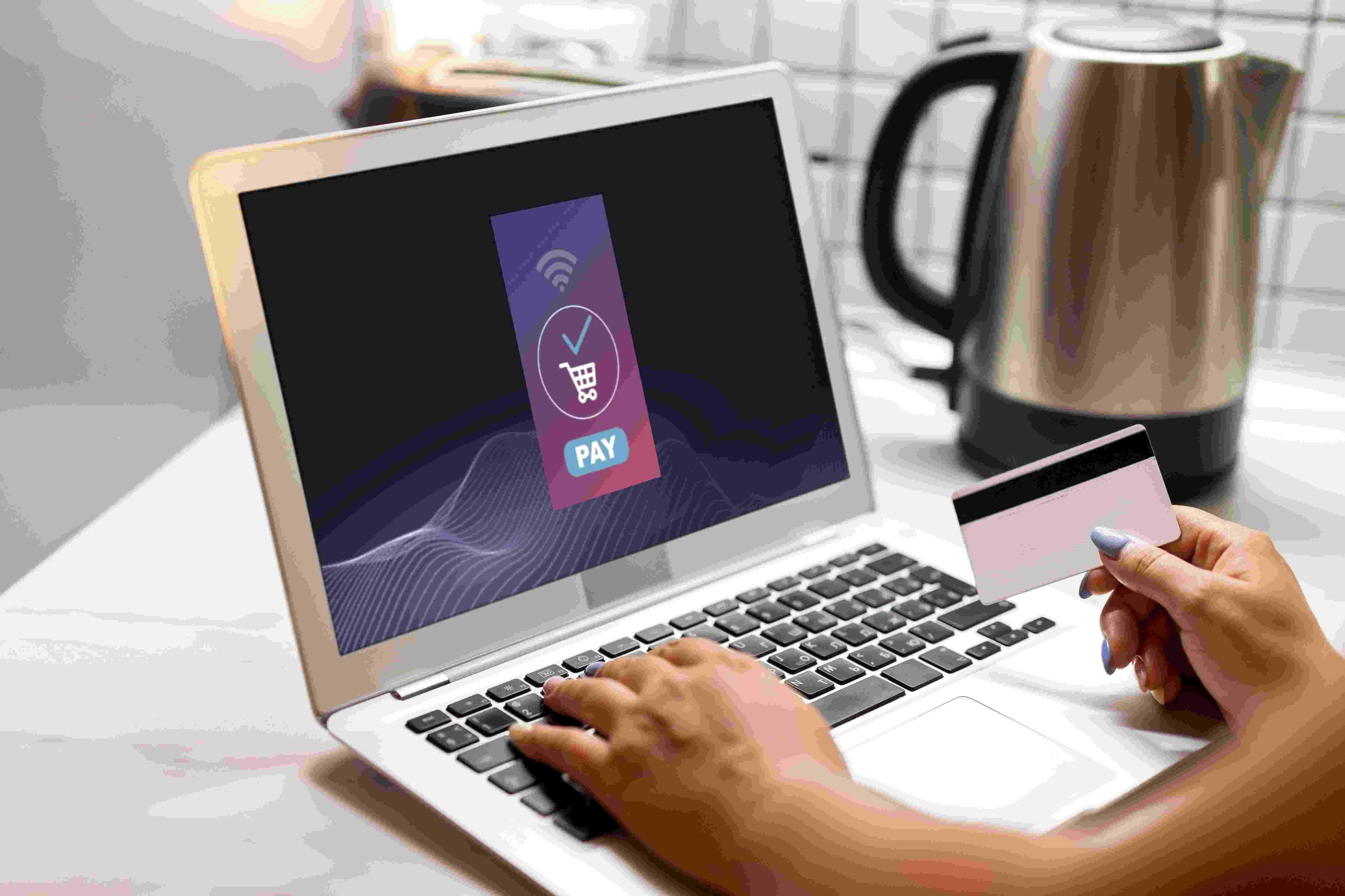 side-view-woman-using-laptop-online-shopping-with-credit-card (1) (1)