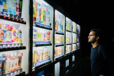 Man looks at drinks cabinet confused over choice